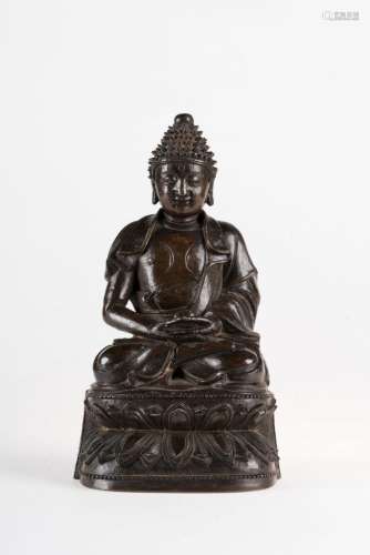 Chinese Art A dark bronze figure of Amitabha bearing a long inscription engraved on both sides of the base China, Ming dynasty