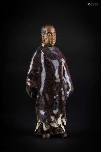 Chinese Art A glazed earthenware figure of a standing dignitary bearing a mark at the base Korea or China, 20th century