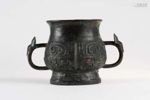 Chinese Art An archaic style bronze vassel decorated with taotie masks China, 20th century
