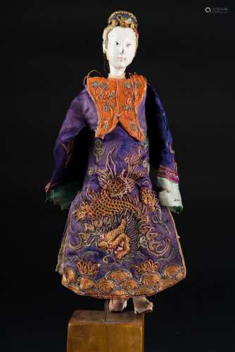 Chinese Art A wooden lacquer and silk doll China, 19th-20th century