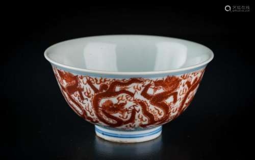 Chinese Art A small porcelain bowl painted with red dragons chasing the flaming pearl and bearing a Jiajing six character mark painted at the base China, 19th century or earlier