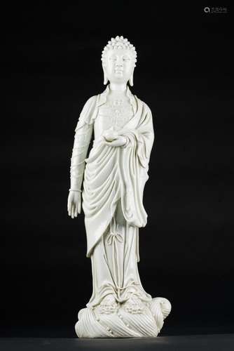 Chinese Art A blanc de Chine porcelain figure of a standing Buddha holding a pot China, Qing dynasty, 19th century