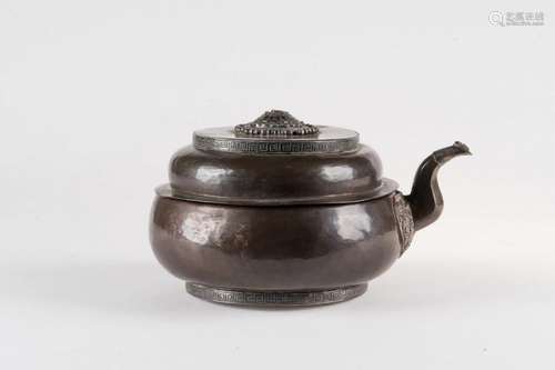 Himalayan Art A copper and silver embossed teapot Tibet, 19th century