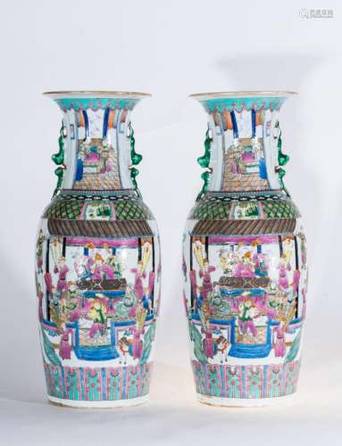 Chinese Art A pair of large famille rose porcelain vases decorated with cortly scenes and bearing a six character iron red seal mark at the base China, Qing dynasty, late 19th century