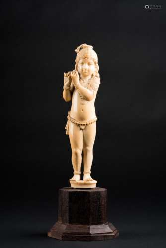 Indian Art An ivory carving portraying Lord Krishna as a child playing the flute India, 19th century