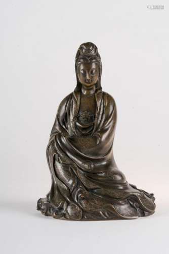 Chinese Art A dark bronze figure of seated Guanyin decorated with floral silver inlays China, Qing dynasty, 19th century or earlier