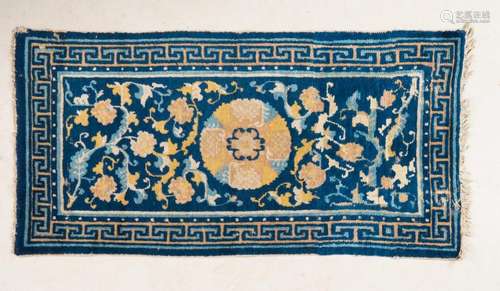 Chinese Art A Chinese Ningxia carpet decorated with floral motifs over blue ground