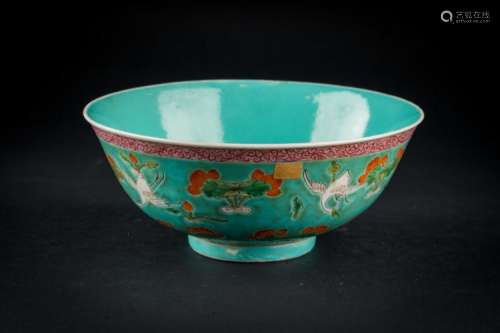 Chinese Art A porcelain bowl painted with cranes and lotus over turquoise ground and bearing a spurious Qianlong six character seal mark at the base China, early 20th century