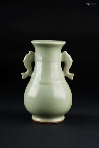 Chinese Art A small celadon glazed pottery bottle with fish shaped handles China, late Ming dynasty