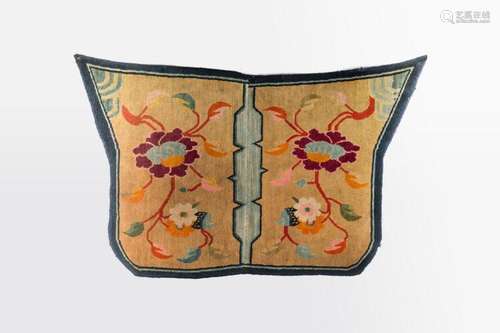 Himalayan Art A saddle carpet decorated with peonies over cream ground Tibet, 19th century