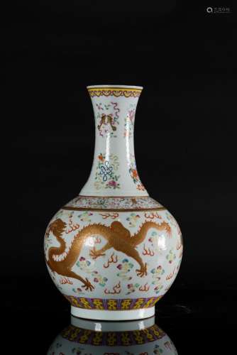 Chinese Art A bottle vase decorated with Buddhist emblems and golden dragons chasing the flaming pearl among clouds. Six character red Guangxu mark at the base. China, 20th century