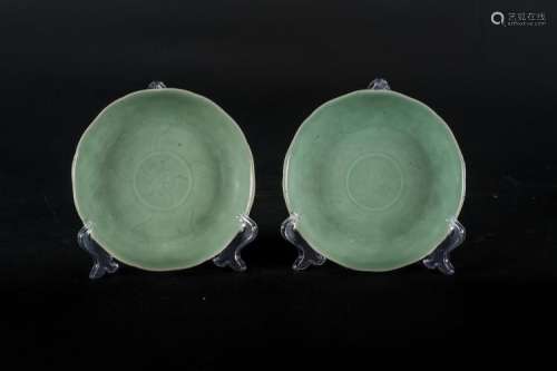 Chinese Art A pair or celadon pottery dishes incised with petals and central flower China, Qing dynasty, 18th century