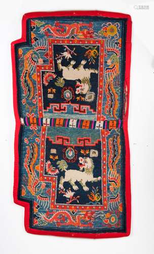 Himalayan Art A saddle carpet decorated with two snow lions and dragons Tibet, 19th century