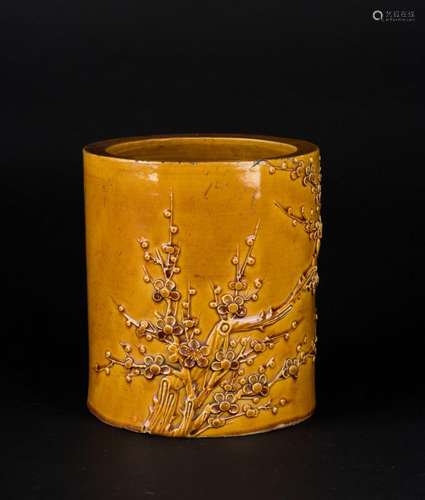 Chinese Art A yellow glazed brush holder (bitong) decorated with blossoming branches and bearing a four character mark at the base China, Qing dynasty, 19th century