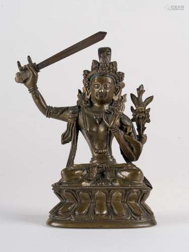 Himalayan Art A dark bronze figure of Manjusri (Wenshu) China, Qing dynasty, late 18th century