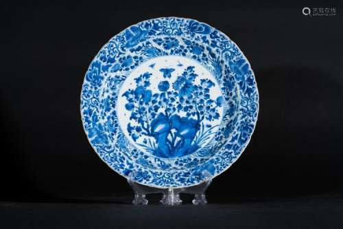 Chinese Art A blue and white porcelain dish painted with floral motifs and bearing an auspicious symbol as a mark at the base China, Qing dynasty, Kangxi period (1661-1722)