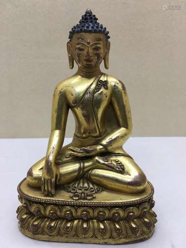 Himalayan Art A gilt bronze figure of seated Aksobya Tibet, 16th-17th century (?)