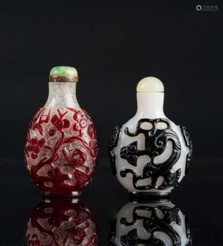 Chinese Art Two Beijing glass snuff bottles and stoppers decorated with red and black cameo glass China, Qing dynasty, 19th century