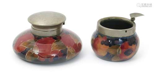 'Pomegranate' a Moorcroft Pottery inkwell with electroplated cover designed by William Moorcroft