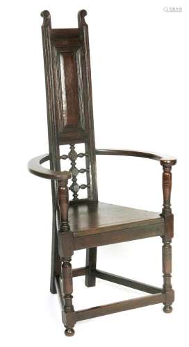 An Aesthetic Movement ebonised wood Shakespeare chair in the manner of E W Godwin