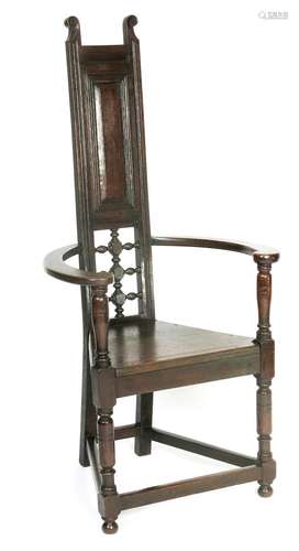 An Aesthetic Movement ebonised wood Shakespeare chair in the manner of E W Godwin