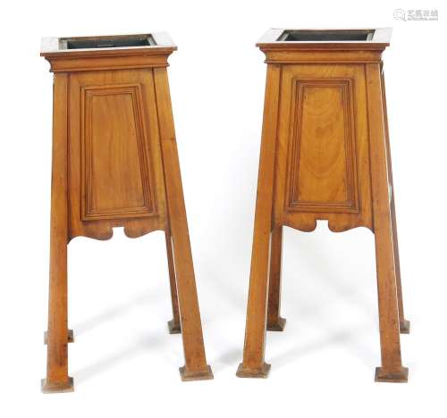 A pair of mahogany planters possibly retailed by Liberty & Co