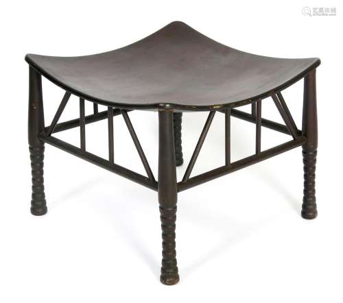 An ebonised wood Thebes stool probably retailed by Liberty & Co