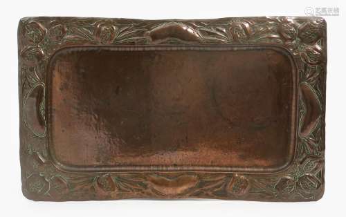 A repousse hammered copper tray