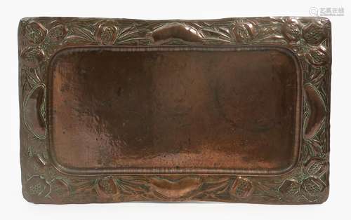 A repousse hammered copper tray