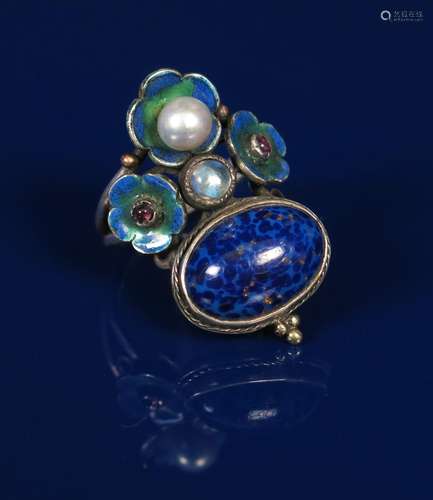 A large silver and enamel ring in the manner of George Hunt