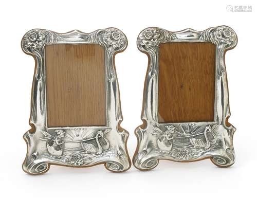 A pair of silver plated copper photograph frames