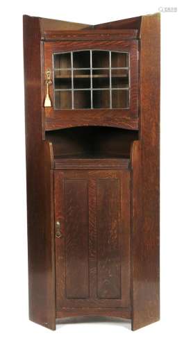 A Liberty & Co oak corner cupboard