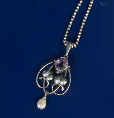 A silver and amethyst pendant necklace