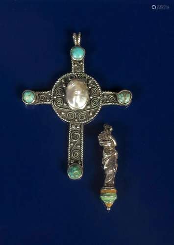 A silver and turquoise Celtic cross pendant