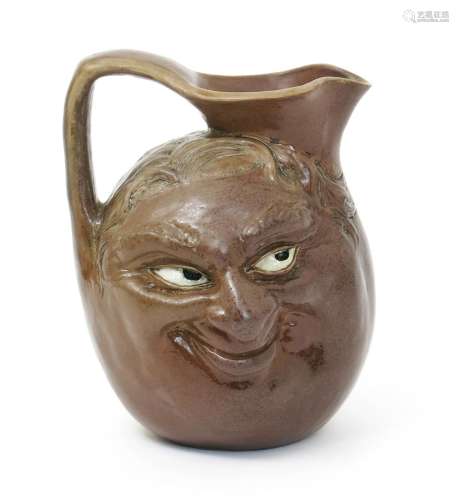 A rare Martin Brothers stoneware double sided face jug