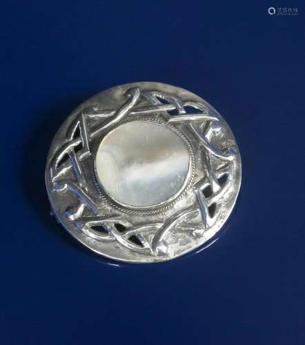 A Celtic silver and mother of  pearl brooch