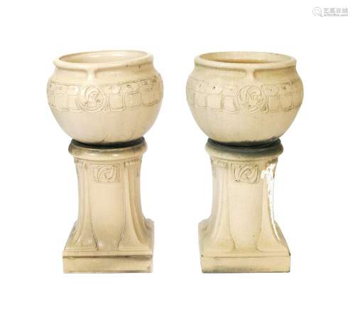 A pair of Leeds Fireclay Lefco Ware jardiniere and stands