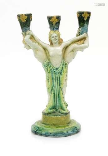 A rare Della Robbia Pottery three-branch candlestick by Marian de Caluwe