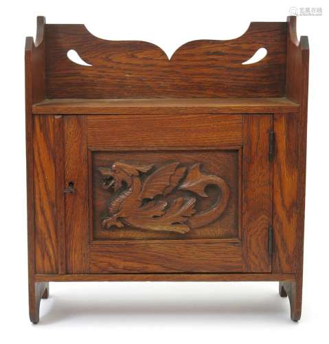 A small Liberty & Co oak wall cabinet