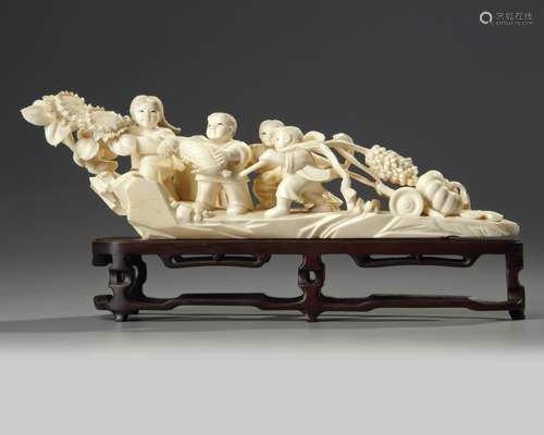 A Chinese carved ivory 'children and vegetable' carving