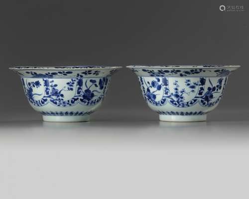 A pair of Chinese blue and white floral klapmuts bowls