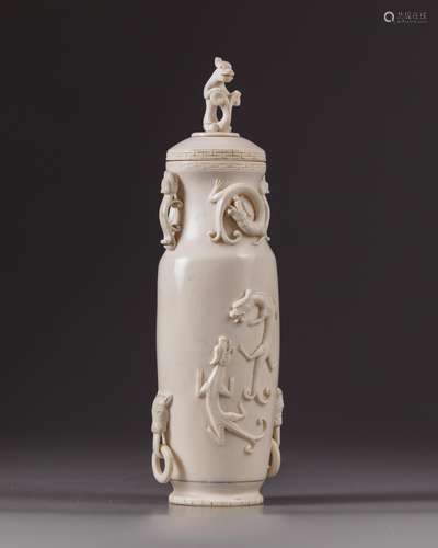 A Chinese ivory chilong vase and cover