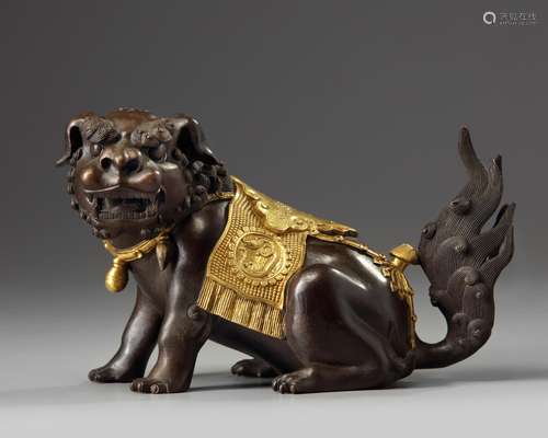 A Chinese parcel-gilt bronze Buddhist lion