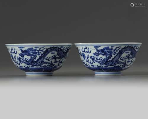 A pair of Chinese blue and white 'dragon' bowls