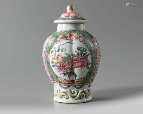 A Chinese famille rose moulded tea caddy and cover