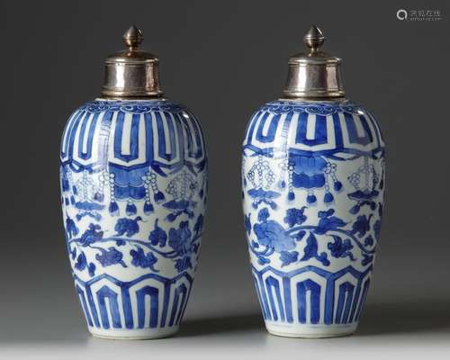 A pair of silver-mounted Chinese blue and white ovoid vases and covers