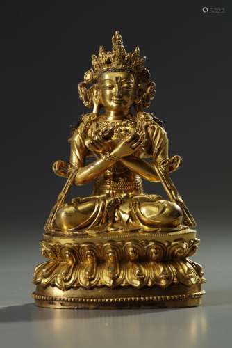 A Sino-Tibetan gilt bronze figure of Vajradhara