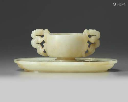 A Chinese white jade ‘twin chilong’ cup stand and a pale celadon jade cup