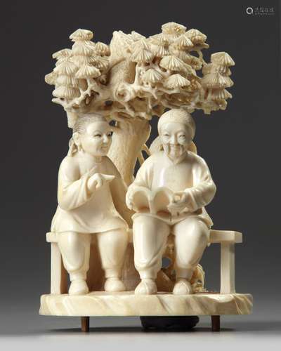 A Chinese ivory carving of an elderly couple