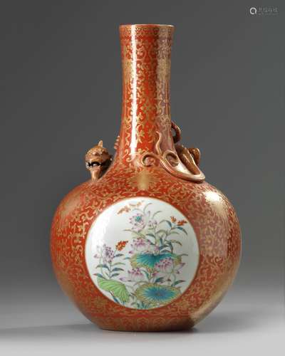 A Chinese iron-red-ground gilt-decorated famille rose bottle vase